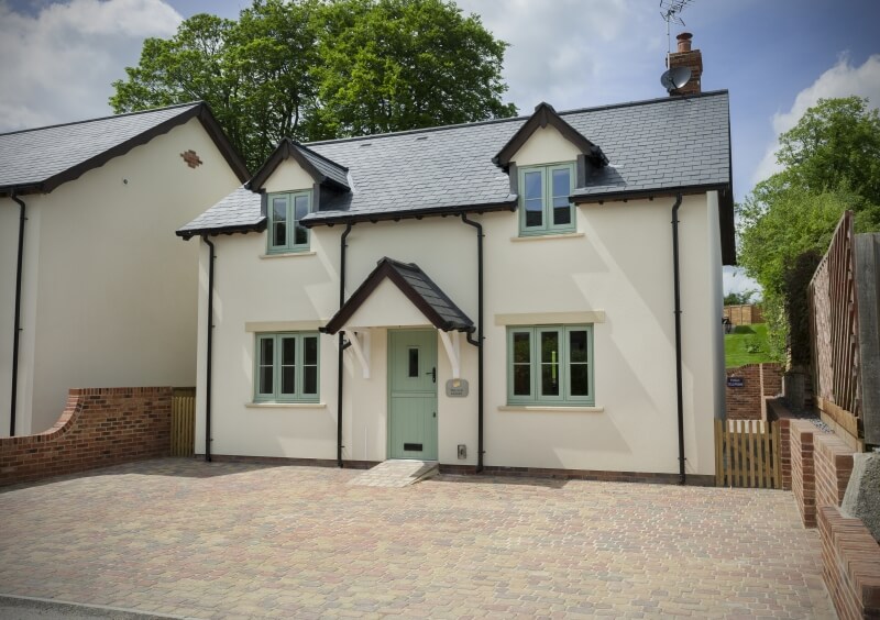 Green residence 9 flush sash windows on a white home